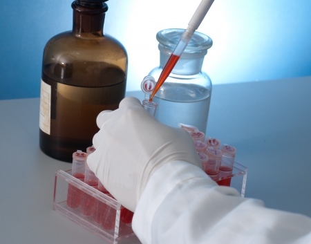 centrifuge tube and glassware with color water in desk