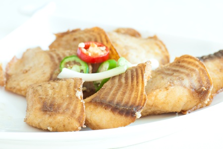 The roasted fillet of tilapia served with capsicumの写真素材