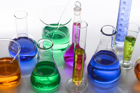glass laboratory apparatus with color waterの写真素材