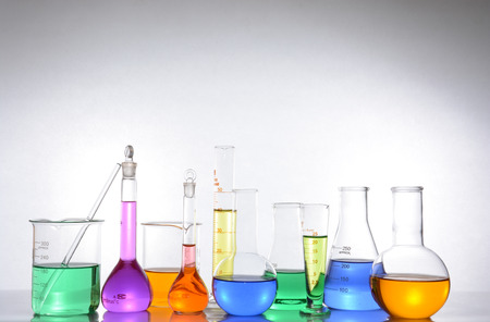 glass laboratory apparatus with color waterの写真素材