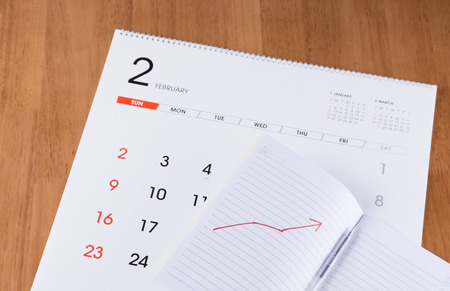 Notebook and pen on a calendar
