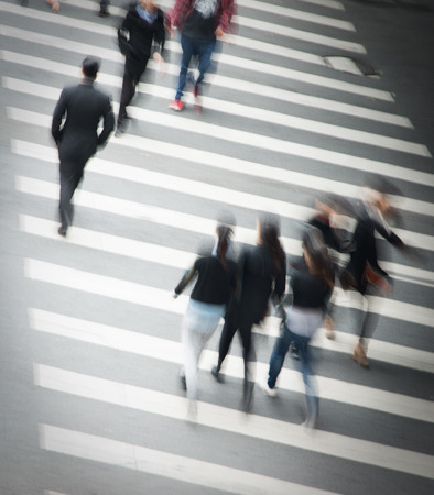 Busy city street people on zebra crossingの写真素材