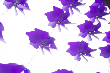 a string of colours Windmills in white backgroundの写真素材