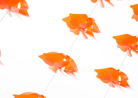 a string of colours Windmills in white backgroundの写真素材