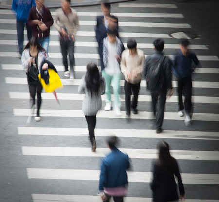 Busy city street people on zebra crossingの写真素材