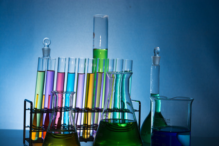 glass laboratory apparatus with color waterの写真素材