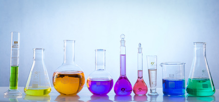 glass laboratory apparatus with color waterの写真素材