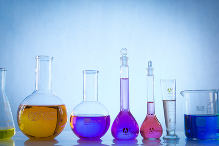 glass laboratory apparatus with color waterの写真素材