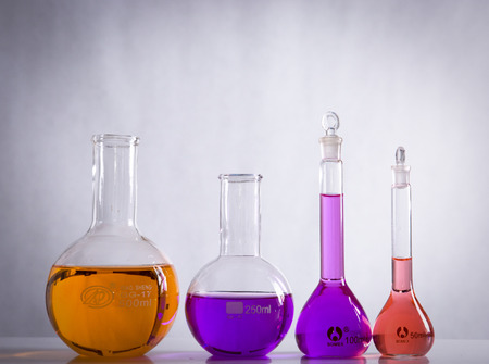 glass laboratory apparatus with color waterの写真素材