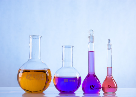glass laboratory apparatus with color waterの写真素材