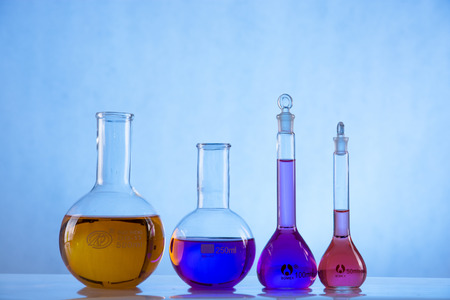 glass laboratory apparatus with color waterの写真素材
