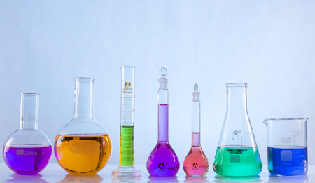 glass laboratory apparatus with color waterの写真素材