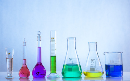glass laboratory apparatus with color waterの写真素材