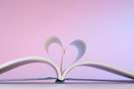 Heart Shaped Book on desk.の写真素材