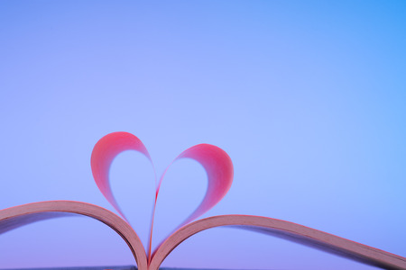 Heart Shaped Book on desk.の写真素材