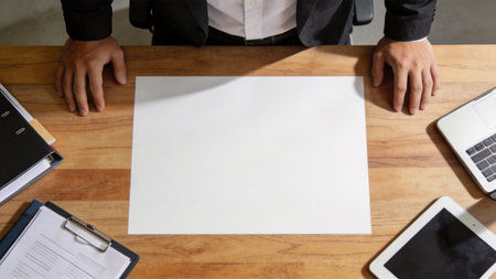 Businessman working with blank paper on office desk. Top view.の素材