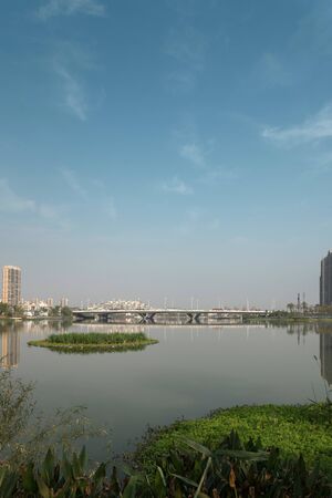 City building reflection by the riverの写真素材