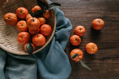 Oranges on wooden tableの写真素材