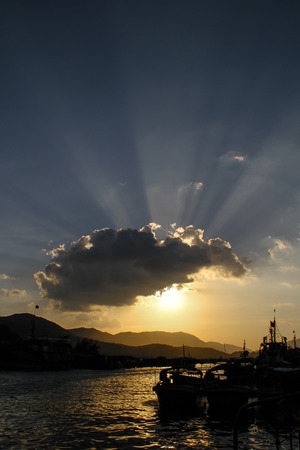 China Sanya Begonia Bay Glowing rays shine in all directions  fishing port  Begonia Bay is located in the northeastcoast of Hainan Province, Sanya City, 28 km away from Sanya City, adjacent to the South and the Yalong Bay National Resort district  And Yalの写真素材