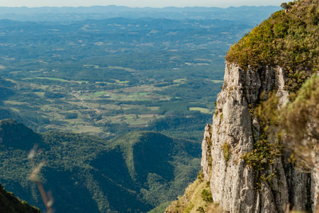 Stone big wall in the funnel canyon with sea of ââclouds, typical landscape of the Santa Catarina mountain range in southern Brazil.の写真素材