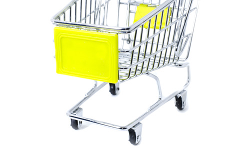 cropped front view shopping trolley, isolated on white backgroundの写真素材