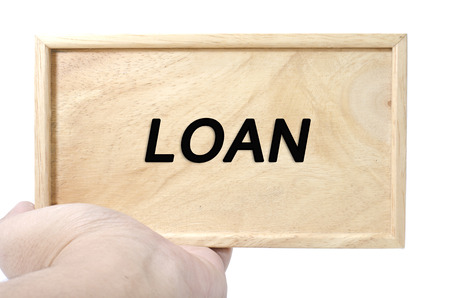 Business and advertising concept. hand holding plain wood with word loanの写真素材