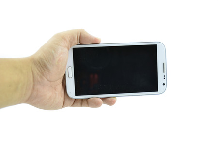 hand holding smart phone isolated white backgroundの写真素材