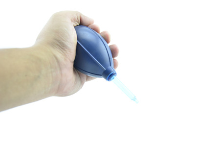 hand hold down air blower isolated white backgroundの写真素材