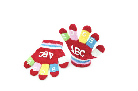 red glove with word ABCDEFGIJ right side up isolated white backgroundの写真素材