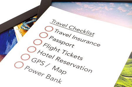 travel checklist printed on white paper. colorful background frameの写真素材