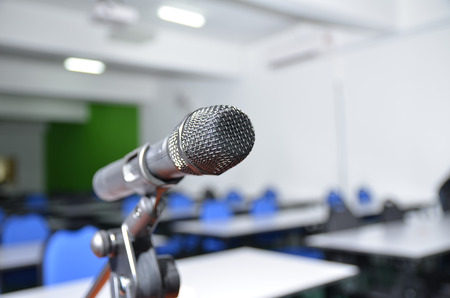 image focusing to the microphone in the training room with seating and tablesの写真素材