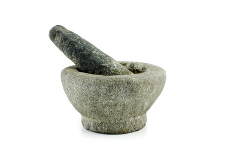 traditional stone mortar and pestle isolated on white backgroundの写真素材