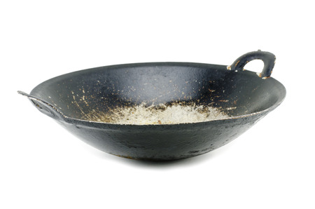 dirty and oily wok after frying, isolated on white backgroundの写真素材