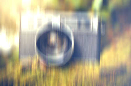 blurred image Old and vantage look, image of film camera over mossy forest backgroundの写真素材