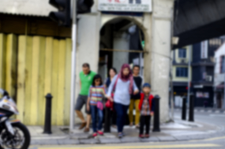blurred image background, group of pedestrian crossing the road at sunny day.の写真素材
