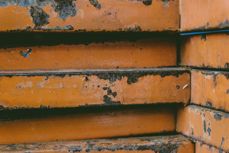 closed up stacks of rusty stainless rectangular pipe bar background.faded effect and selective focusの写真素材