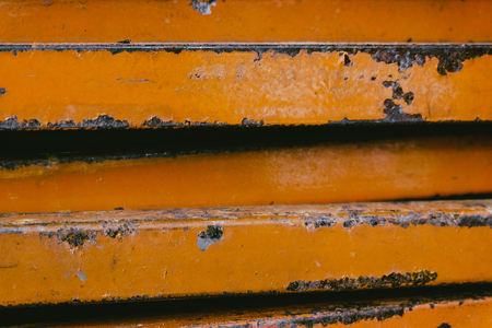 closed up stacks of rusty stainless rectangular pipe bar background.faded effect and selective focus
