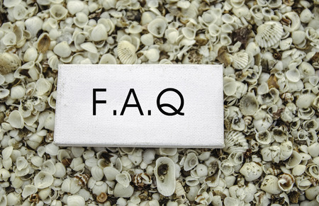 conceptual business motivation image,  word FAQ on white canvas. blur clamshell and Cockles backgroundの写真素材