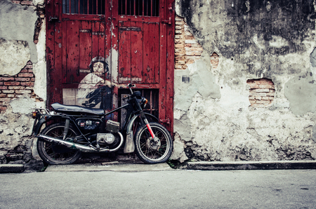 PENANG, MALAYSIA-30 DECEMBER 2011: Penang street art,One of 9 mural painted by Ernest Zacharevic in Penang on July 6, 2013.のeditorial素材