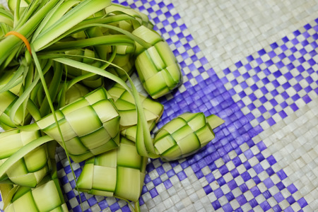 Ketupat or Dumpling Rice. A rice is cook in natural casing made from young coconut leaves. most iconic food during Eid Mubarak Celebration in Malaysia.の写真素材