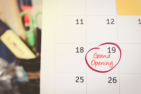 handwriting word grand opening on calendar over blurred background.selective focus shotの写真素材