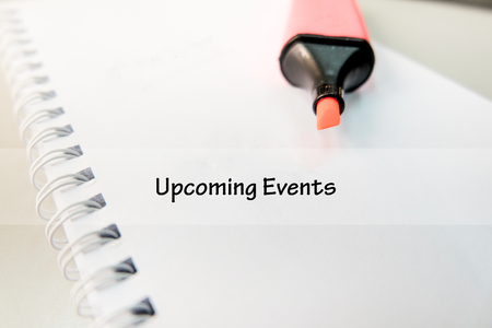 word UPCOMING EVENTS on white book with highlighter pen ideal for business success conceptの写真素材