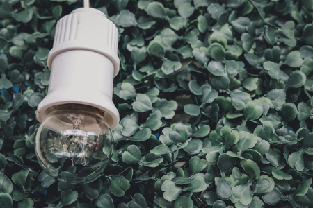 cropped image, simple decoration with green artificial turf, star and bulb