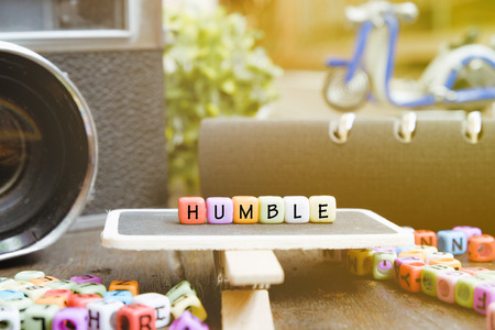 conceptual image with HUMBLE word block on wooden signage over soft focus backgroundの写真素材