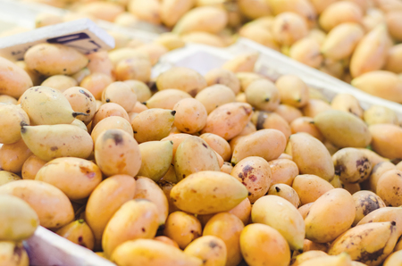 selective focus shot,fresh mangoes display in the market stall table