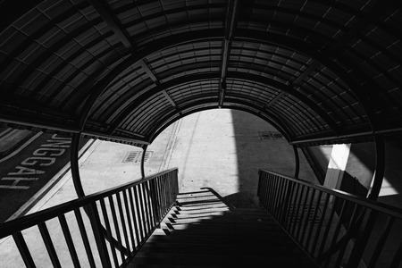 black and white image of pedastrian flyover at sunny dayの写真素材