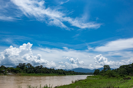 Beautiful scenery of Perak River located at Perak State, Malaysia over mountain and cloudy sky...