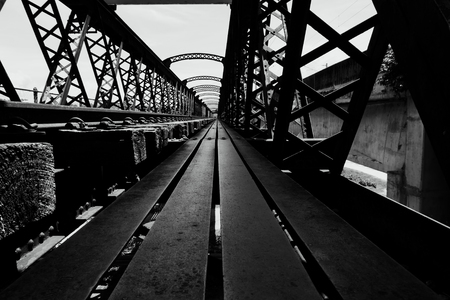 Black and white image, perspective view of old railway bridgeの写真素材
