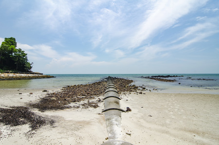 tropical sandy beach at sunny day and blue sky backgroundの写真素材