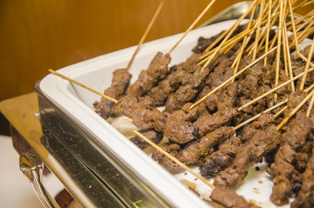 Malaysian famous dishes, beef satay.marinated with variety of spice and grilled on charcoal stoveの写真素材